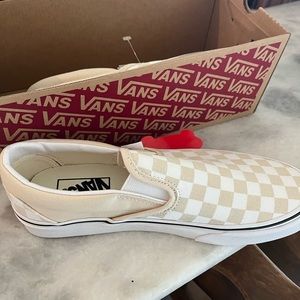 New in box (no lid) Vans Classic Slip Ons, women size 8.5, men 7, checkerboard